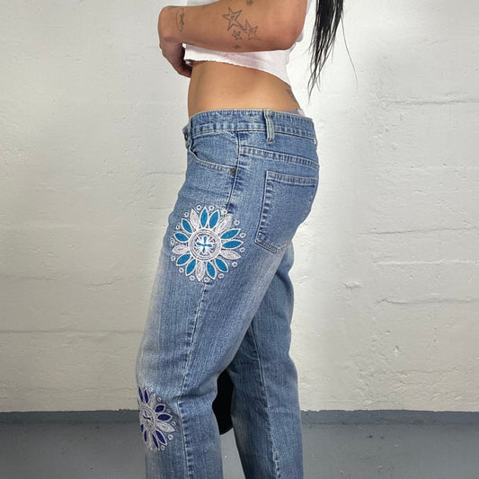 Vintage 2000's Downtown Girl Light Blue Wash Out Effect Bootcut Jeans with Multicoloured Embroidery (L)
