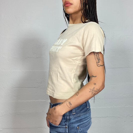 Vintage 2000's Cute Beige Top with White "Baby Shirt" Print (S)