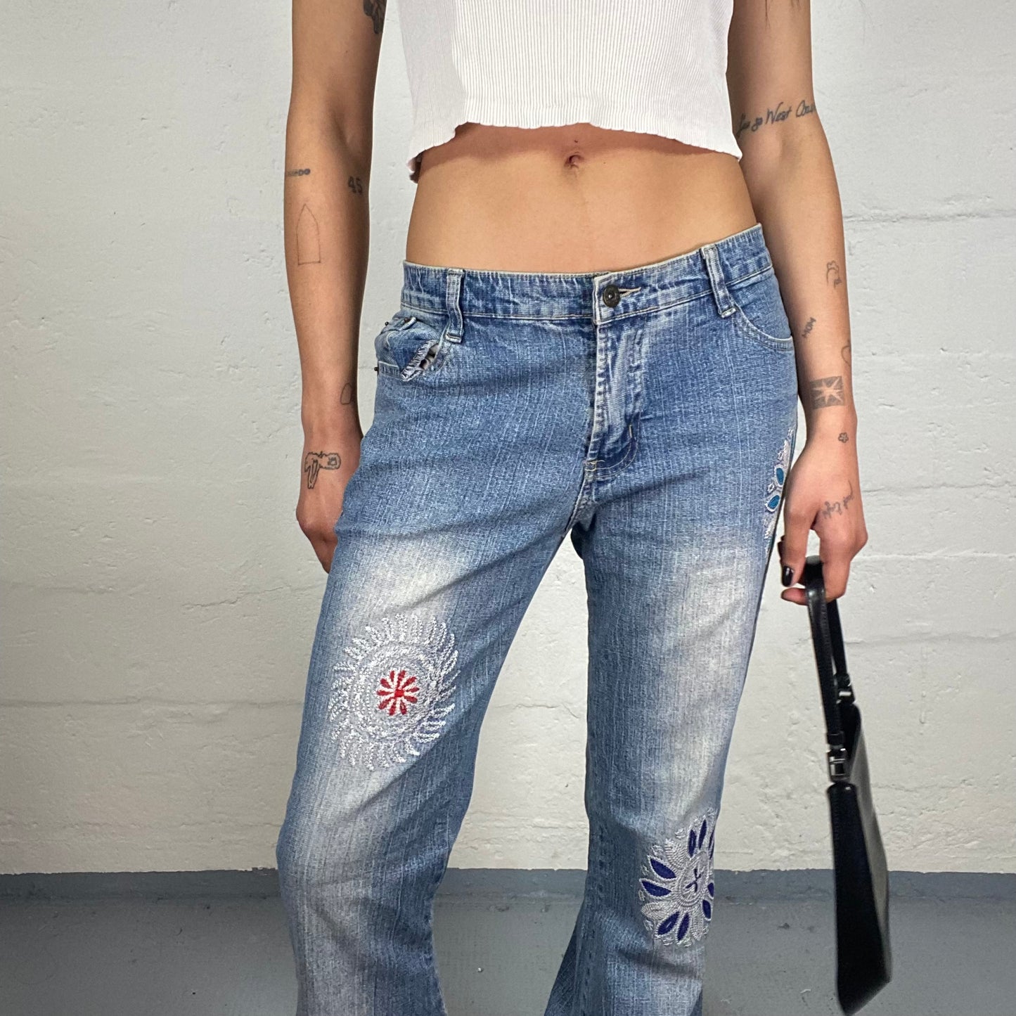 Vintage 2000's Downtown Girl Light Blue Wash Out Effect Bootcut Jeans with Multicoloured Embroidery (L)