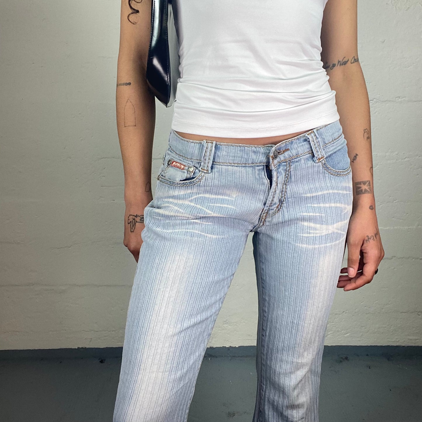 Vintage 2000's Downtown Girl Light Blue Washed Out Striped Low Waisted Flared Jeans (M)