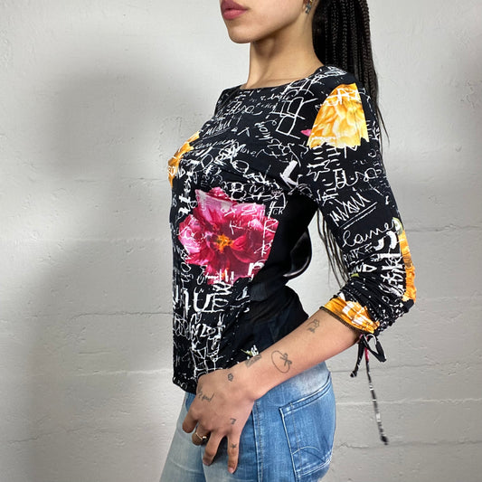 Vintage 2000’s Casual Black 2/4 Ruffled Sleeve and Mesh Back Top with White Typography and Multicoloured Flowers Print (M)