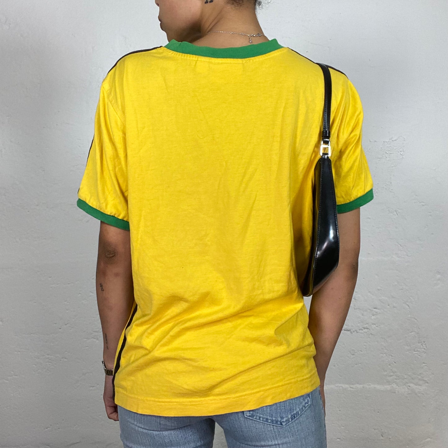 Vintage 2000's Archive Puma Sporty Yellow T-Shirt with Black and Green Details (L)