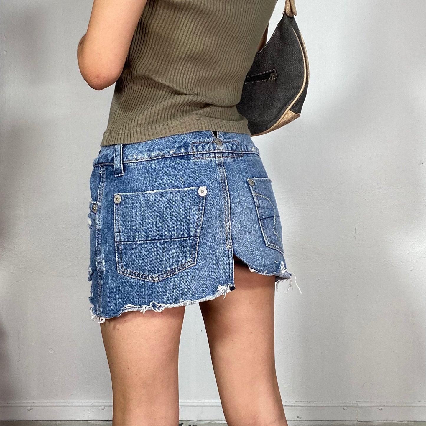 Vintage 2000's Downtown Girl Denim Ripped Mini Skirt with Leather Strap Detail (S)