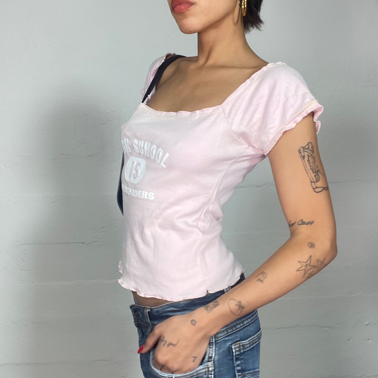 Vintage 2000's Totally Spies Baby Pink Off Shoulder Top with White "High School 15 Cheerleader" Print (M)