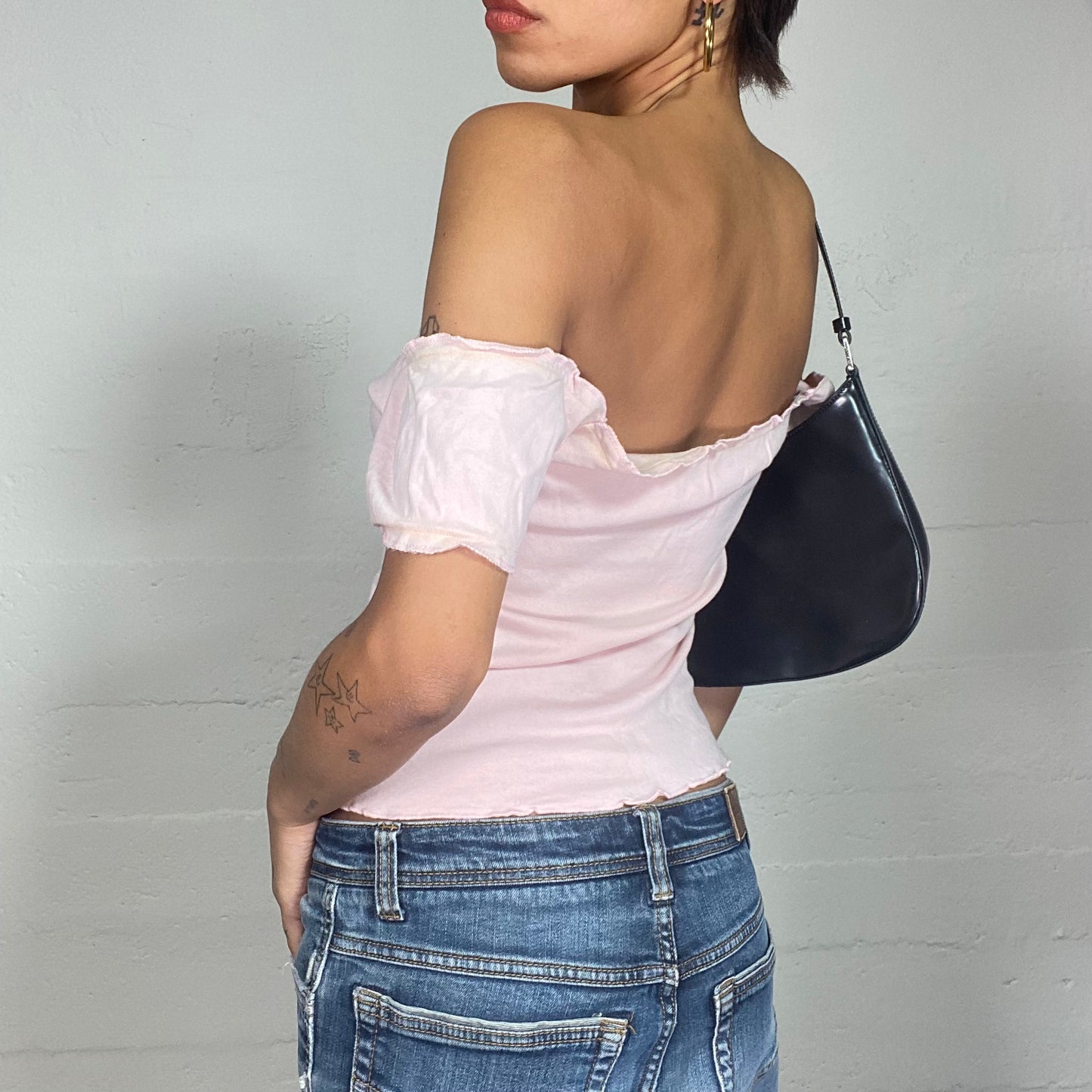 Vintage 2000's Totally Spies Baby Pink Off Shoulder Top with White "High School 15 Cheerleader" Print (M)