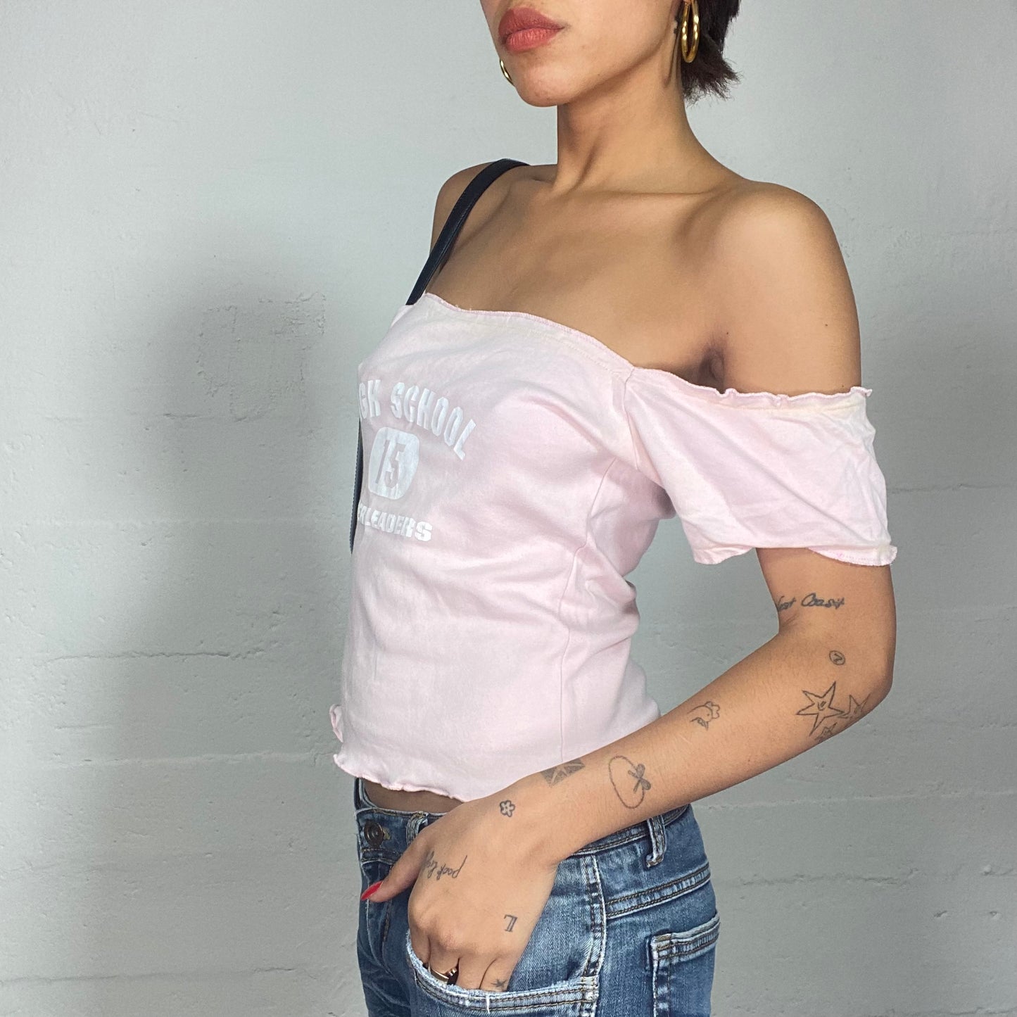 Vintage 2000's Totally Spies Baby Pink Off Shoulder Top with White "High School 15 Cheerleader" Print (M)