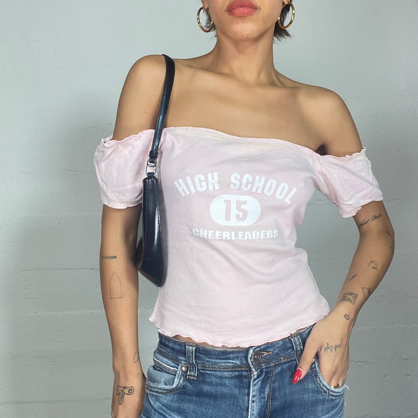 Vintage 2000's Totally Spies Baby Pink Off Shoulder Top with White "High School 15 Cheerleader" Print (M)