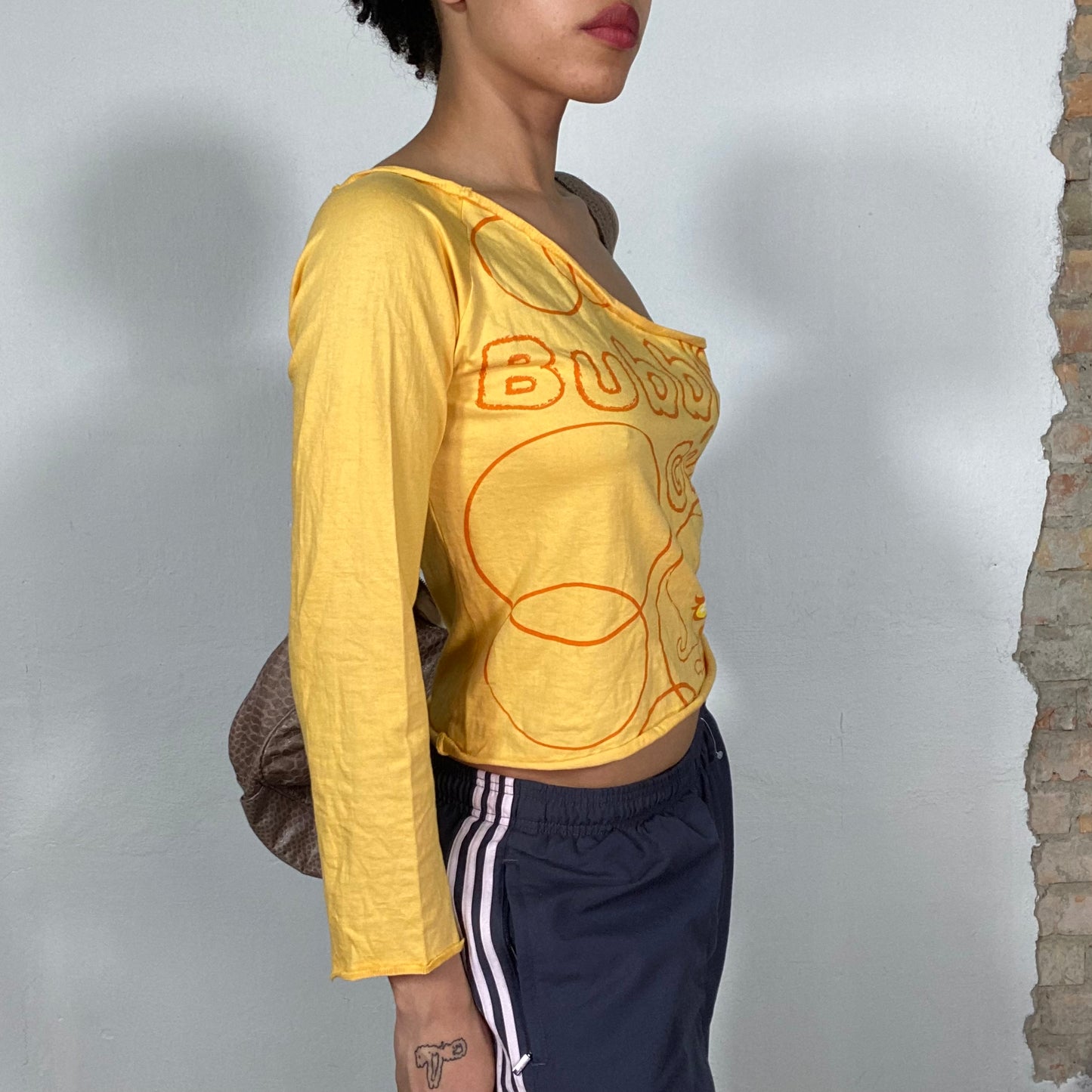 Vintage 90's Streetstyle Yellow One Shoulder Top with 'Bubbly Girl' Print (S/M)